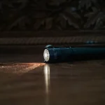 Compact flashlight switched on